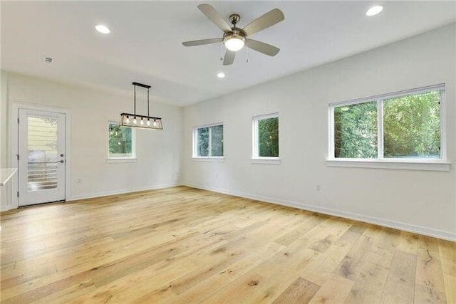 6800 Menchaca Rd Unit 45, Austin, TX 78745 - spare room with light wood-style floors, ceiling fan, and recessed lighting