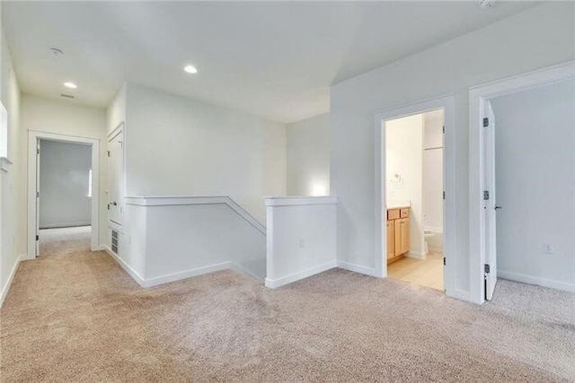 6800 Menchaca Rd Unit 45, Austin, TX 78745 - hall with light colored carpet, an upstairs landing, and recessed lighting