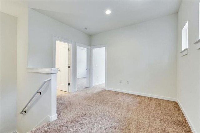 6800 Menchaca Rd Unit 45, Austin, TX 78745 - spare room featuring light carpet and recessed lighting