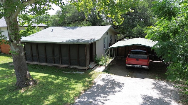 10801 W Lakeview Dr, Jonestown, TX 78645 - view of outbuilding featuring a carport and asphalt driveway
