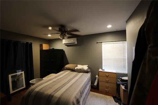 10801 W Lakeview Dr, Jonestown, TX 78645 - bedroom with an AC wall unit, ceiling fan, and recessed lighting