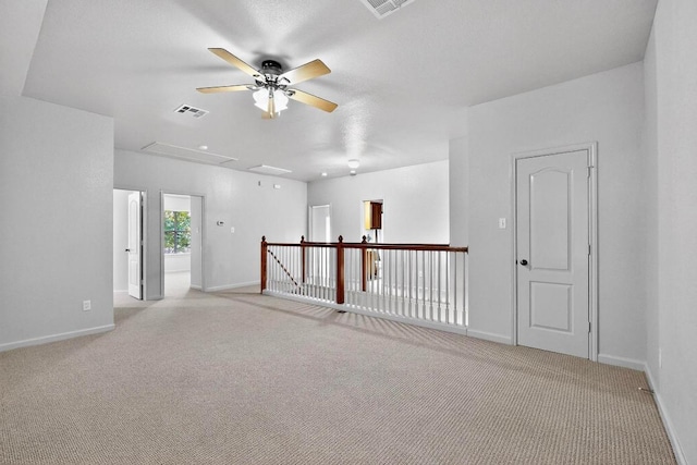 1532 Homewood Cir, Round Rock, TX 78665 - unfurnished room with attic access, a ceiling fan, and light colored carpet