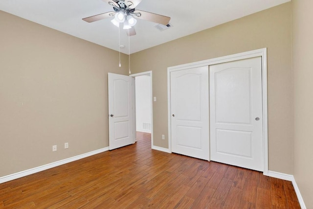1532 Homewood Cir, Round Rock, TX 78665 - unfurnished bedroom featuring wood finished floors, a closet, and ceiling fan