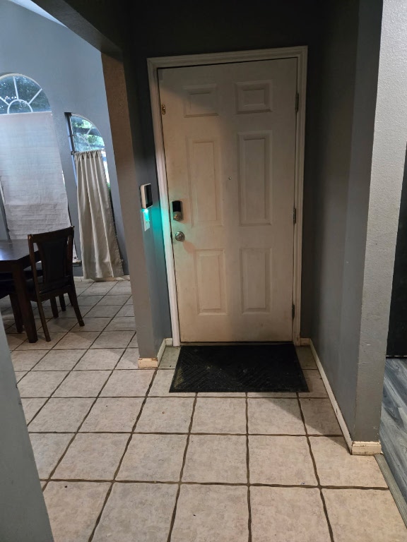 1608 Peridot Rd, Pflugerville, TX 78660 - entryway with light tile patterned floors and baseboards