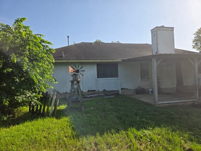 1608 Peridot Rd, Pflugerville, TX 78660 - rear view of property with a patio area, a chimney, and a yard