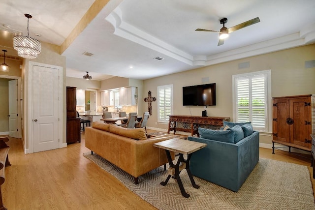 260 N Santa Clara Ave, New Braunfels, TX 78130 - living room with a ceiling fan, light wood-type flooring, and a raised ceiling