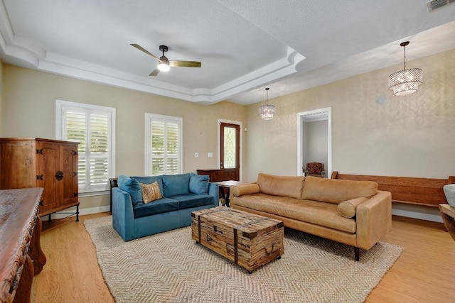 260 N Santa Clara Ave, New Braunfels, TX 78130 - living area featuring light wood-style flooring, a tray ceiling, and ceiling fan