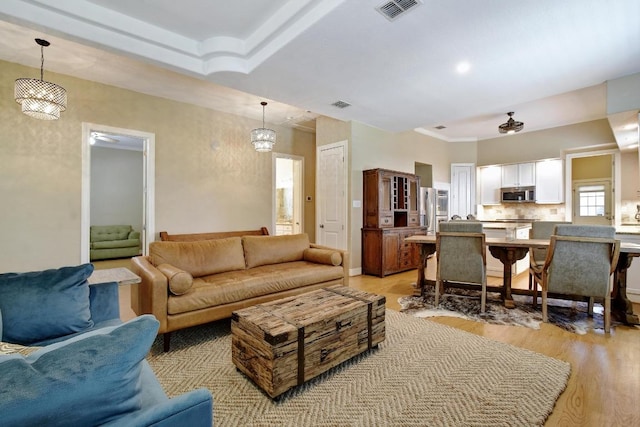 260 N Santa Clara Ave, New Braunfels, TX 78130 - living room with light wood-type flooring and crown molding