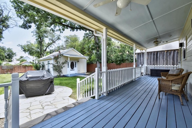 260 N Santa Clara Ave, New Braunfels, TX 78130 - deck with ceiling fan, a fenced backyard, area for grilling, and an outbuilding
