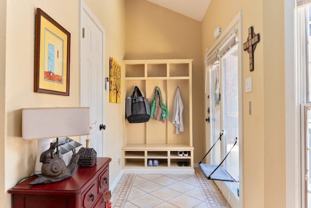 3200 Duval St Unit 309, Austin, TX 78705 - mudroom featuring light tile patterned flooring, plenty of natural light, and lofted ceiling