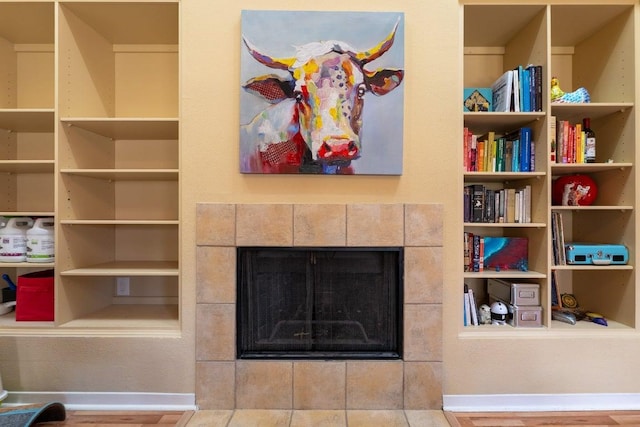 3200 Duval St Unit 309, Austin, TX 78705 - living room featuring a fireplace and wood finished floors