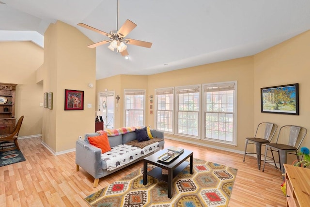 3200 Duval St Unit 309, Austin, TX 78705 - living area with light wood-style flooring, ceiling fan, and high vaulted ceiling