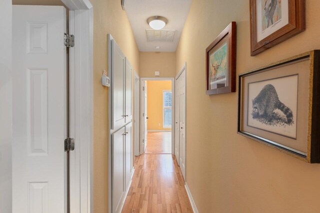 3200 Duval St Unit 309, Austin, TX 78705 - corridor with light wood-style floors and baseboards