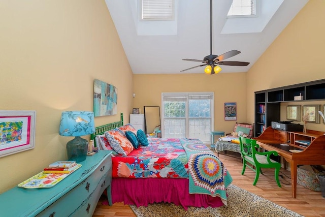 3200 Duval St Unit 309, Austin, TX 78705 - bedroom featuring a skylight, high vaulted ceiling, wood finished floors, and ceiling fan
