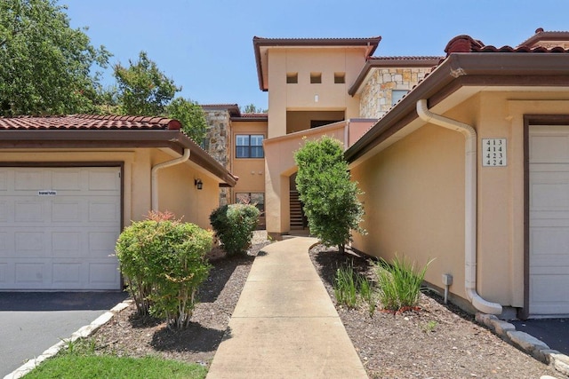 300 San Gabriel Village Blvd Unit 423, Georgetown, TX 78626 - property entrance with stucco siding and a tile roof