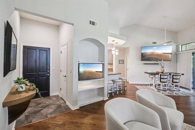 300 San Gabriel Village Blvd Unit 423, Georgetown, TX 78626 - foyer entrance with high vaulted ceiling and dark wood-style flooring