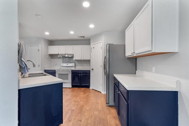 620 Lavaca Loop, Elgin, TX 78621 - kitchen featuring white electric stove, under cabinet range hood, blue cabinets, white cabinets, and light wood-style flooring