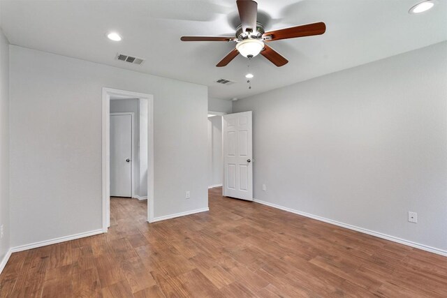 620 Lavaca Loop, Elgin, TX 78621 - unfurnished bedroom with wood finished floors, recessed lighting, and ceiling fan