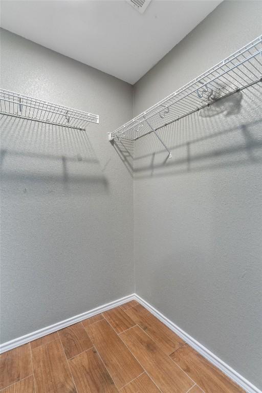 620 Lavaca Loop, Elgin, TX 78621 - spacious closet featuring wood finished floors