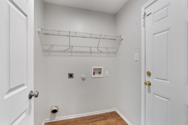 620 Lavaca Loop, Elgin, TX 78621 - laundry area with hookup for an electric dryer, dark wood finished floors, hookup for a gas dryer, and washer hookup