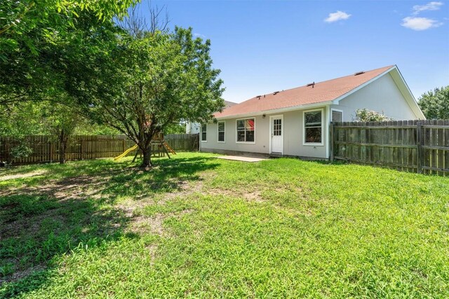 620 Lavaca Loop, Elgin, TX 78621 - back of house featuring a fenced backyard