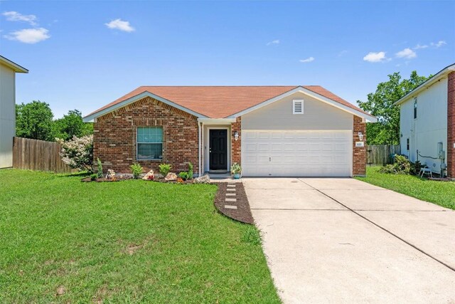 620 Lavaca Loop, Elgin, TX 78621 - view of front of property featuring brick siding, concrete driveway, and a garage