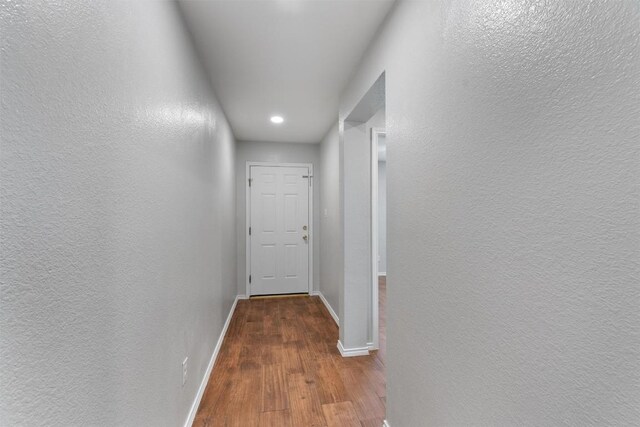 620 Lavaca Loop, Elgin, TX 78621 - hallway with wood finished floors, recessed lighting, and a textured wall
