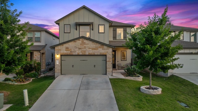 1207 Diggy Dr, Austin, TX 78748 - view of front of home featuring board and batten siding, stone siding, driveway, a garage, and a front lawn
