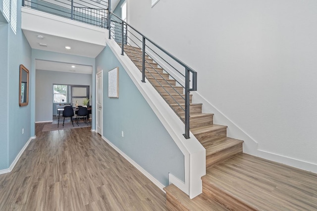 1207 Diggy Dr, Austin, TX 78748 - staircase featuring wood finished floors and baseboards