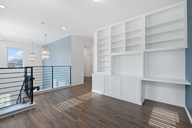 1207 Diggy Dr, Austin, TX 78748 - unfurnished room with a chandelier, dark wood-style floors, recessed lighting, and built in features