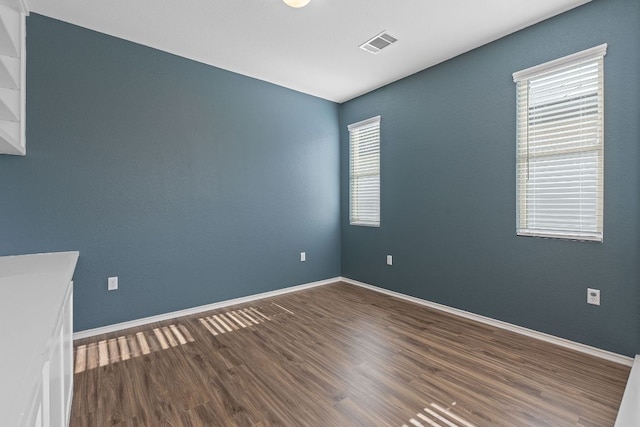 1207 Diggy Dr, Austin, TX 78748 - empty room featuring wood finished floors and baseboards