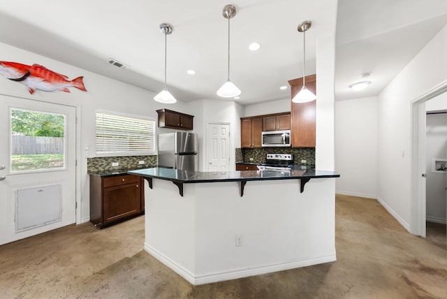 14601 Running Deer Trl, Austin, TX 78734 - kitchen with stainless steel appliances, a kitchen breakfast bar, tasteful backsplash, and recessed lighting
