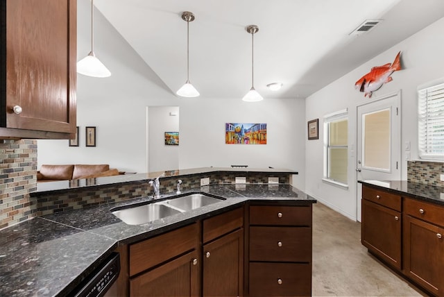 14601 Running Deer Trl, Austin, TX 78734 - kitchen with backsplash, decorative light fixtures, dishwasher, lofted ceiling, and a peninsula