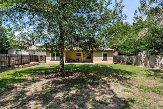 14601 Running Deer Trl, Austin, TX 78734 - rear view of house featuring a fenced backyard and a patio area