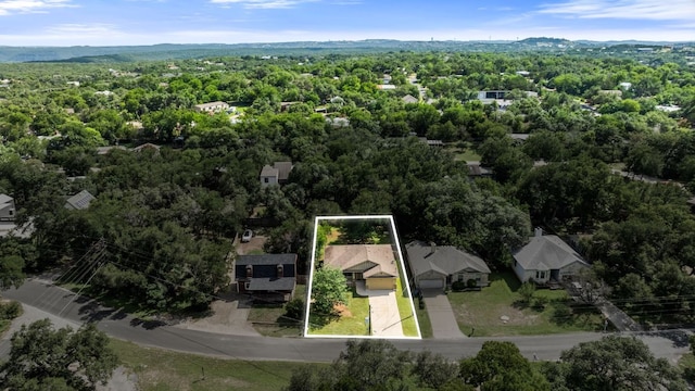 14601 Running Deer Trl, Austin, TX 78734 - aerial view of property and surrounding area with property parcel outlined and a heavily wooded area
