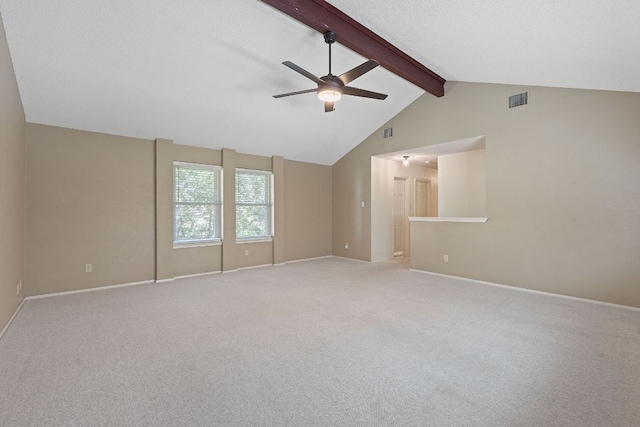 8206 Avocet Dr, Austin, TX 78745 - empty room featuring a ceiling fan, beamed ceiling, light colored carpet, and high vaulted ceiling