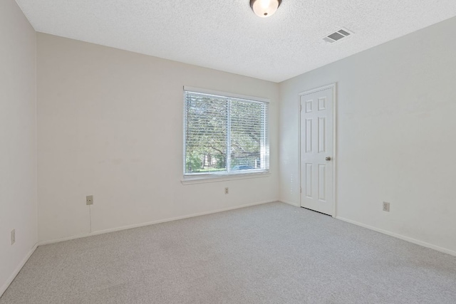 8206 Avocet Dr, Austin, TX 78745 - empty room with light colored carpet and a textured ceiling