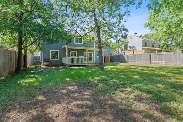8206 Avocet Dr, Austin, TX 78745 - back of house with a wooden deck and a fenced backyard