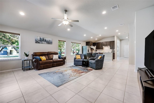 1901 Owens Ln, Lago Vista, TX 78645 - living area featuring a ceiling fan, vaulted ceiling, light tile patterned flooring, and recessed lighting
