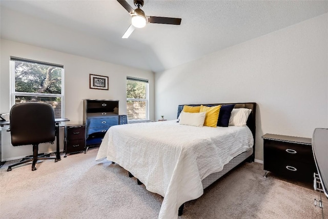 1901 Owens Ln, Lago Vista, TX 78645 - bedroom with light colored carpet, lofted ceiling, a desk, and ceiling fan