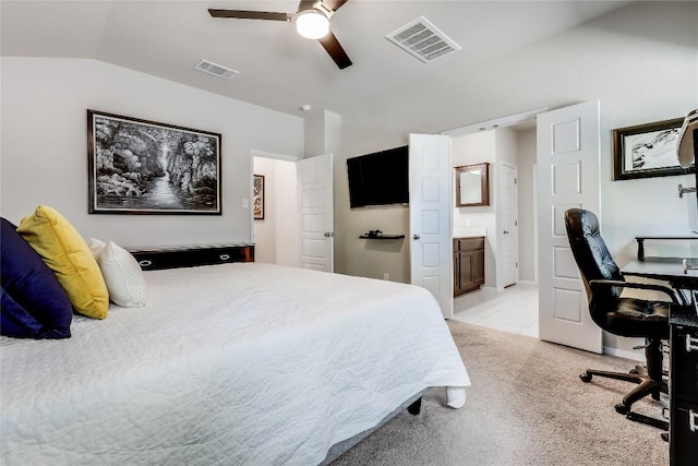 1901 Owens Ln, Lago Vista, TX 78645 - bedroom featuring lofted ceiling, light carpet, a desk, ensuite bath, and a ceiling fan
