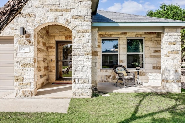 1901 Owens Ln, Lago Vista, TX 78645 - view of exterior entry featuring stone siding and a yard