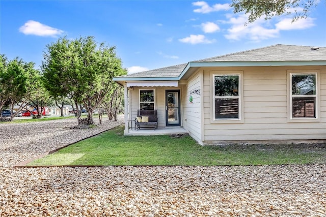 1901 Owens Ln, Lago Vista, TX 78645 - rear view of property featuring a porch and a yard