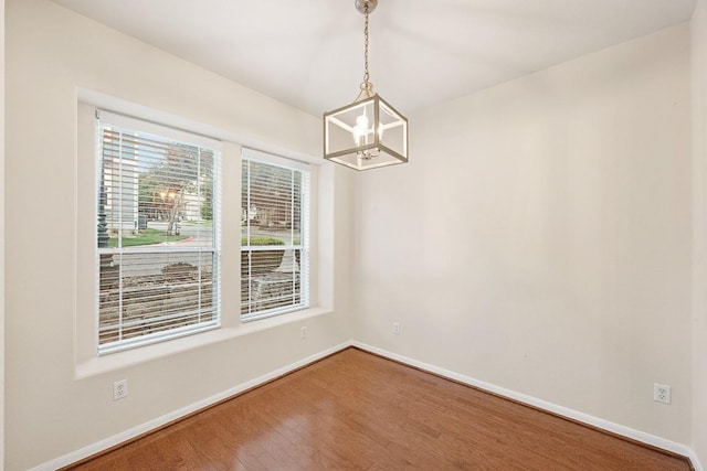 1900 Tramson Dr Unit 94C, Austin, TX 78741 - unfurnished room with a chandelier and wood finished floors