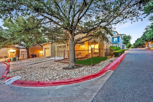 1900 Tramson Dr Unit 94C, Austin, TX 78741 - view of front facade featuring a fenced front yard and a garage