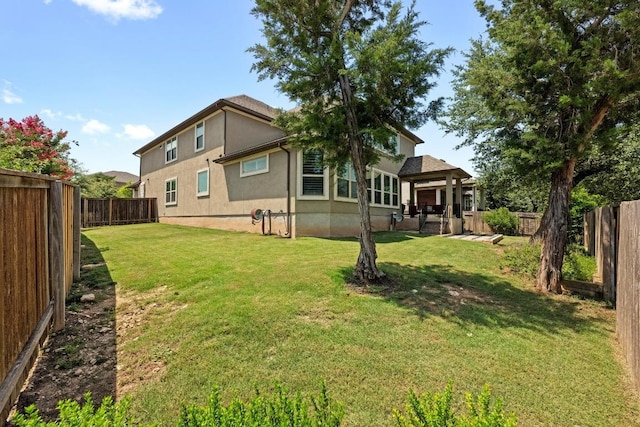 15913 Villa Frontera Dr, Bee Cave, TX 78738 - back of property featuring stucco siding and a fenced backyard