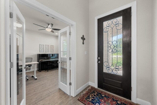 15913 Villa Frontera Dr, Bee Cave, TX 78738 - foyer with french doors, light wood-type flooring, and ceiling fan