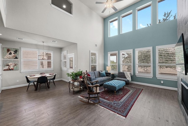15913 Villa Frontera Dr, Bee Cave, TX 78738 - living area with wood finished floors, a towering ceiling, and a ceiling fan