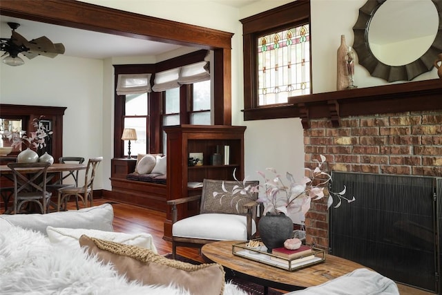 1917 Miles Ave, Austin, TX 78745 - living area featuring wood finished floors, a fireplace, and ceiling fan
