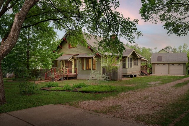 1917 Miles Ave, Austin, TX 78745 - view of front of house with driveway, an outbuilding, and a lawn